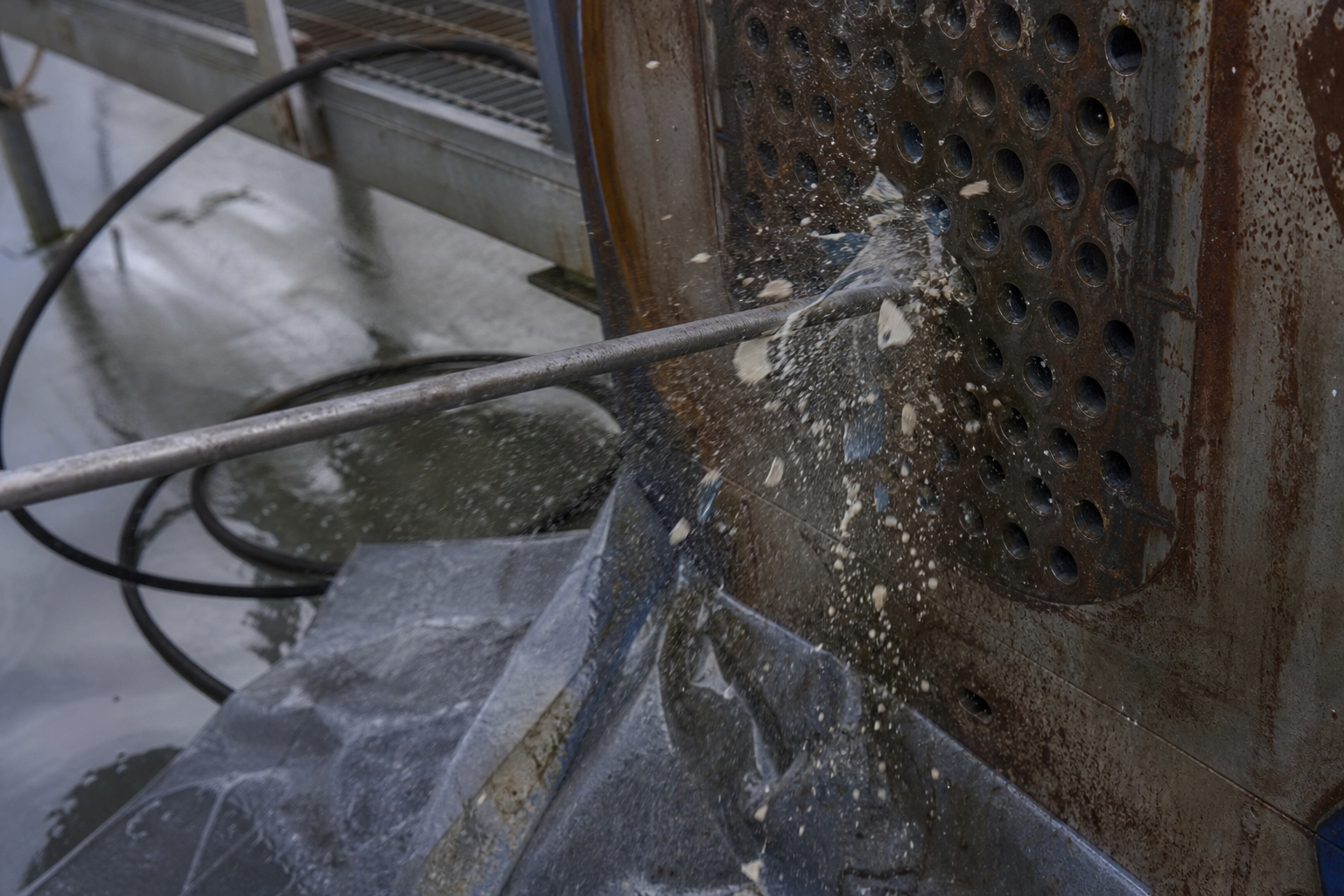 High pressure water jetting lance cleaning scale from inside evaporator tubes