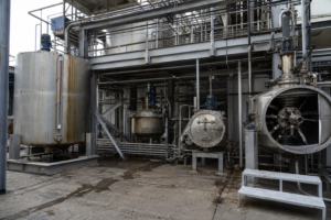 Mother liquor treatment annex with scraped-surface crystallizer and dryer